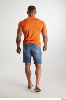 Garrott  1 back view blue jeans shorts dressed flip…